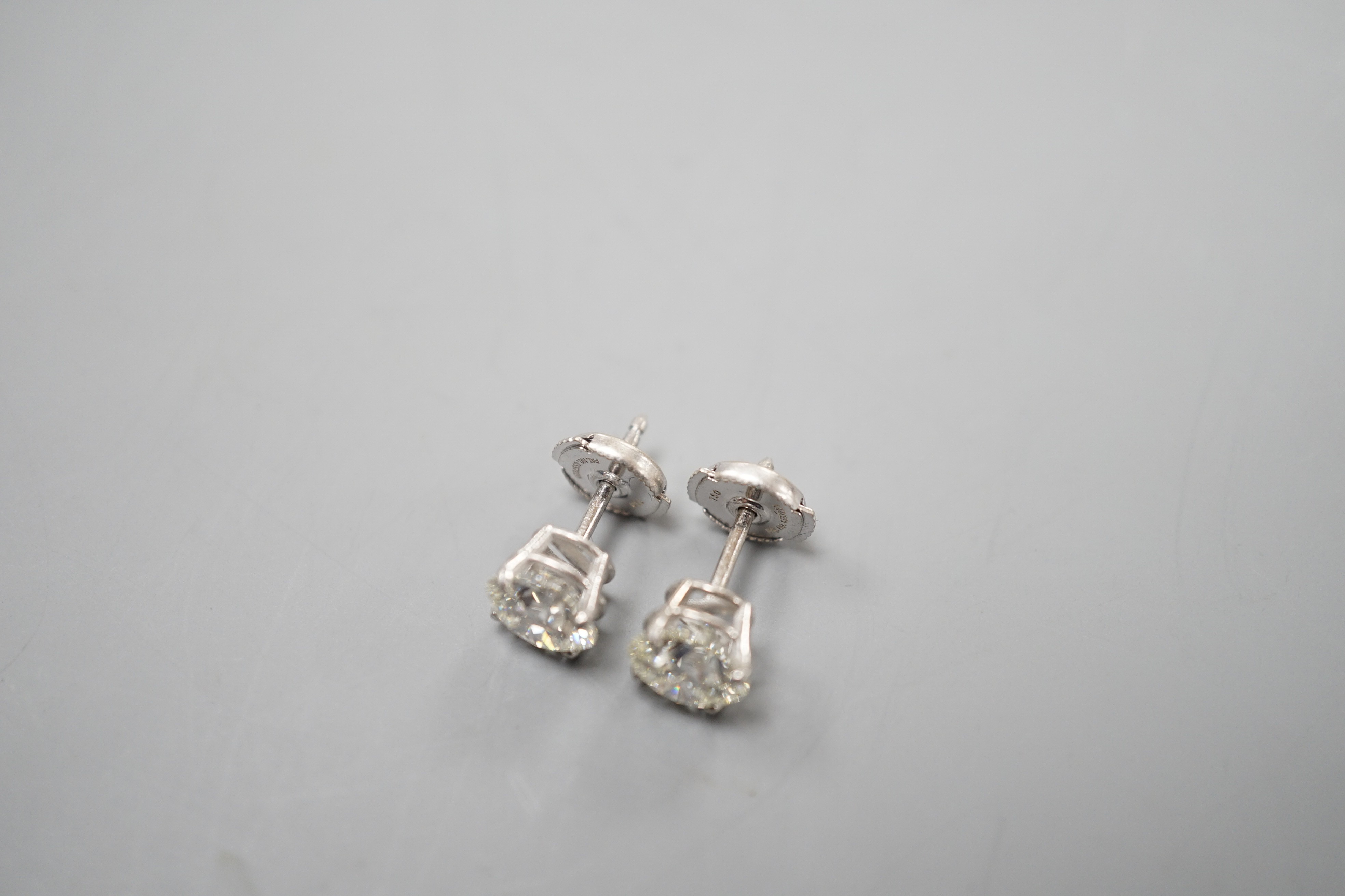 A pair of 750 white metal and solitaire diamond set ear studs, each stone weighing approximately 1.50ct